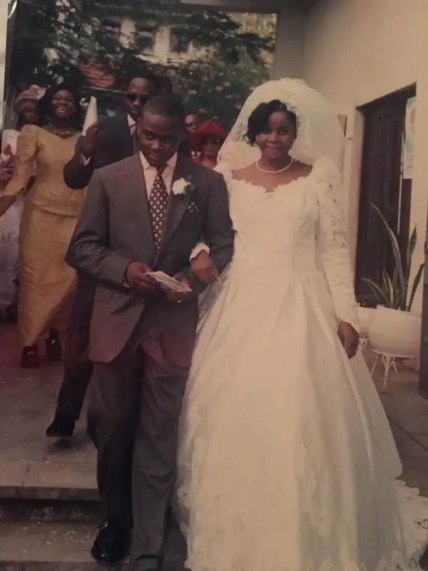 Herbert Onyewumbu Wigwe and wife Chizoba walk down the aisle